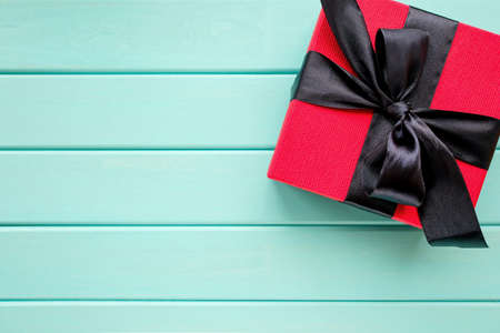 Terracotta wood blurred background. Above is a festive box.の写真素材