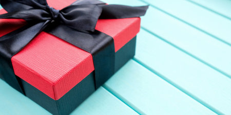 Gift box on a light blue wooden background. Banner, no people.の写真素材