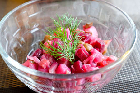 Portion of vinaigrette in a transparent salad bowl. Modest lunch.の写真素材