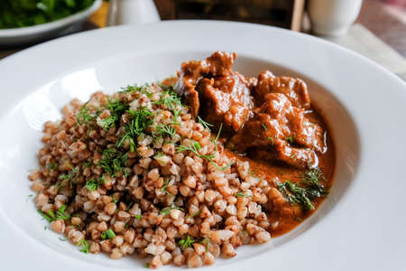 Buckwheat with herbs and meat with sauce. Second course for lunch.の写真素材