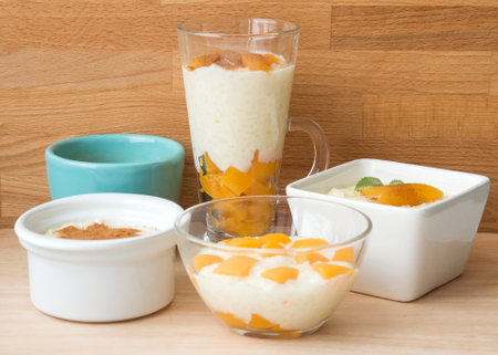 Rice pudding in bowls. Dessert is poured into different dishes.の写真素材