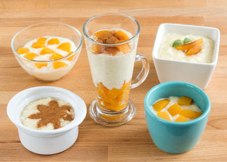 Rice dessert in different small bowls and glasses.の写真素材