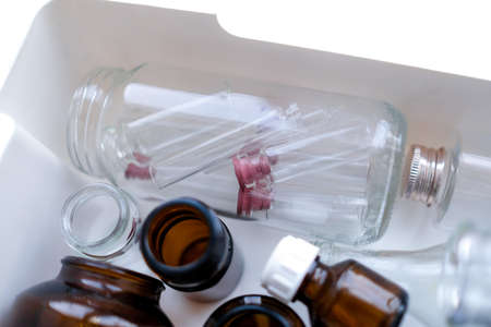 Small glass jars. Transparent and brown bubbles.の写真素材