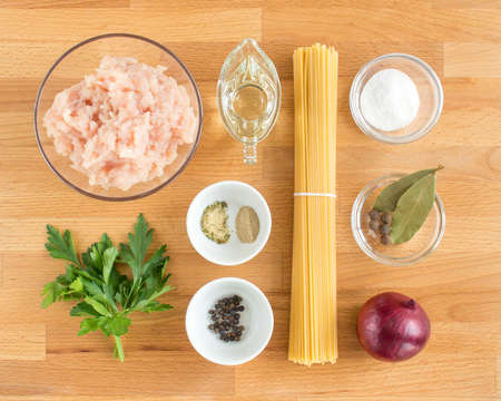 The ingredients are laid out on the table. Cooking minced chicken pasta.の写真素材