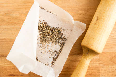 Black pepper balls crushed with a rolling pin.の写真素材