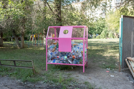Organizing the collection of plastic bottles in the courtyard of apartment buildings.の写真素材