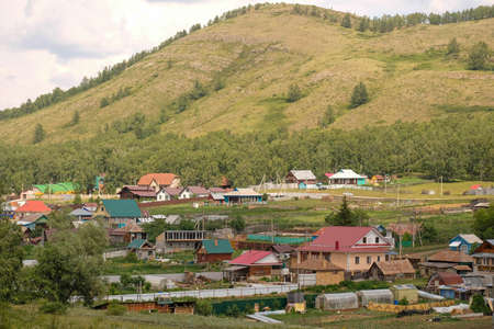 Bashkiria, 06.26.2021 - View of the village. Houses, vegetable gardens and hills are visibleのeditorial素材