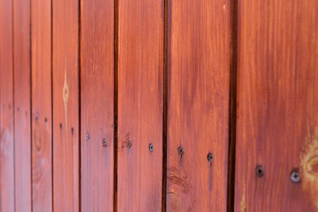 Brown wooden fence on the street. Dense boards.の写真素材