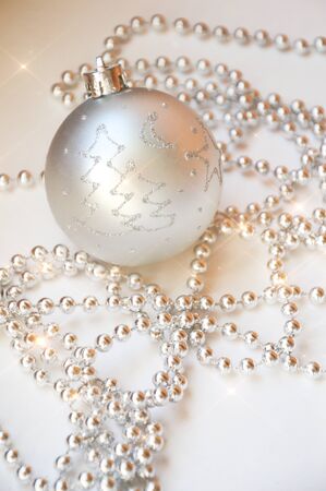 gray Christmas ball on the Christmas tree. shiny ball. metallic color. decorations for the holiday. New year, Christmas. gray beads for decoration. Holiday greeting card. Ball on white background.の写真素材