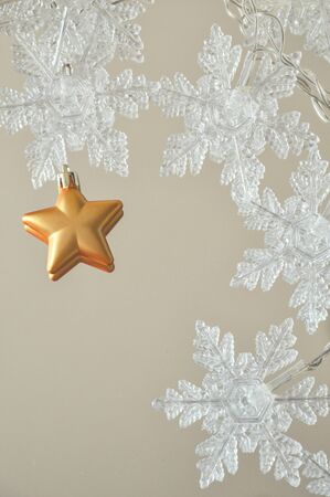 Christmas toy star and garland snowflakes on the mirror. New year, Christmas.