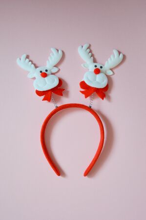 Christmas card on a light background. Decor for Christmas and New year. Merry Christmas. Waiting for the holiday. Decor for Christmas tree decoration and festive mood. Christmas decorations. Make a wish. Wish list. Happy holiday: decorations, candy, Christmas toys.の写真素材