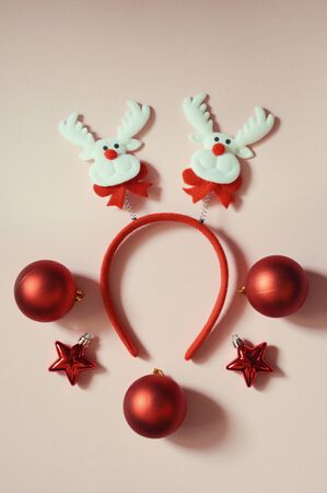 Christmas card on a light background. Decor for Christmas and New year. Merry Christmas. Waiting for the holiday. Decor for Christmas tree decoration and festive mood. Christmas decorations. Make a wish. Wish list. Happy holiday: decorations, candy, Christmas toys.の写真素材