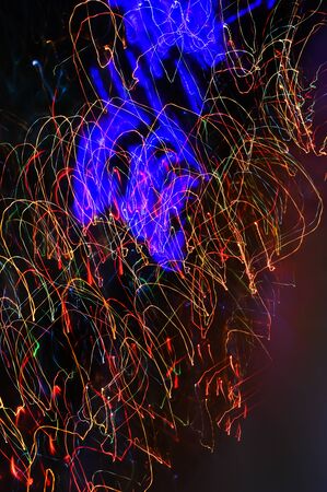 Abstraction. neon, background for the design. colored lines on a dark background.