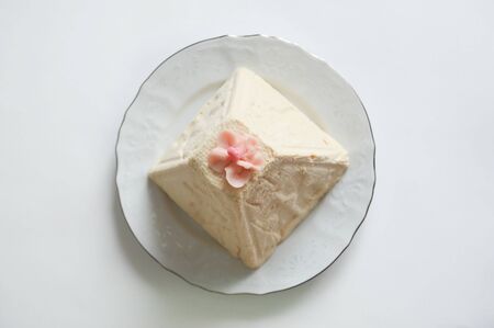 Cottage cheese Easter. Homemade dessert on a white plate.