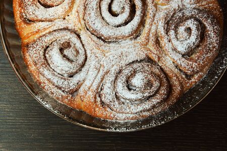 homemade cake. cake with cinnamon and powdered sugar. delicious dessert.の写真素材