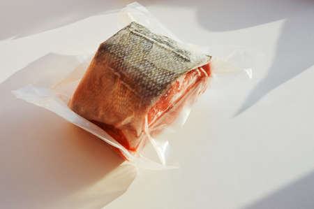 red fish in vacuum packaging. proper nutrition, trout, salmon, chum salmon. marine products.の写真素材