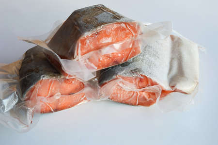red fish in vacuum packaging. proper nutrition, trout, salmon, chum salmon. marine products.の写真素材