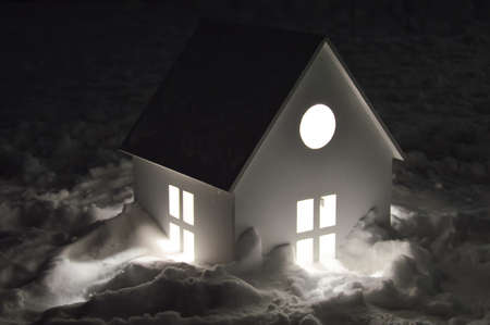 decoration festive of the city park. winter holidays. cute lanterns in the form of a house in the snow. preparation for Christmas and New Year. light decoration.の写真素材