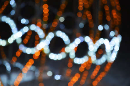 Colorful bokeh lights. Festive shiny background for celebrating Merry Christmas and Happy New Year....