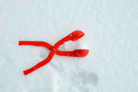 fun winter games in the snow, modeling snowballs.の写真素材
