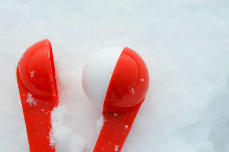 fun winter games in the snow, modeling snowballs.の写真素材