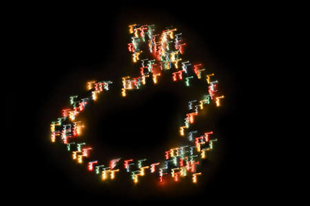 neon outline of a hare. the year of the rabbit, colored lights in the form of an animal on a black background.の写真素材