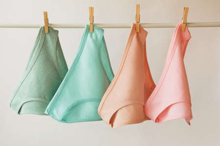 women's underwear. multicolored underpants on a light background. a piece of clothing for a person.の写真素材