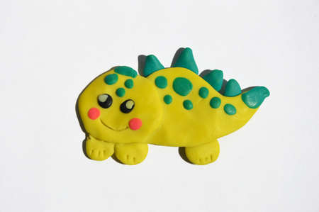 children's crafts. a dinosaur made by the hands of a childの写真素材