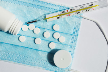 medical mask, pills and thermometer. virus protection. covid. disease prevention