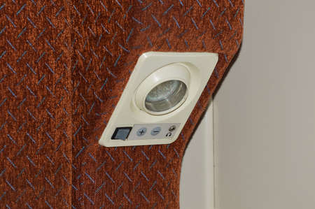 the lamp and switch on the train. lighting in public transport. background for the design.の写真素材