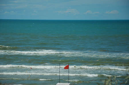 sea waves. turquoise water. summer sea with a sandy shore. warm summer, sun, rest. background for the design.の写真素材