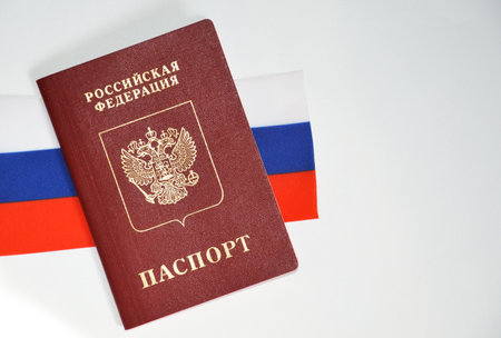 the flag of the Russian Federation and the passport of a Russian citizen on a white background.の写真素材