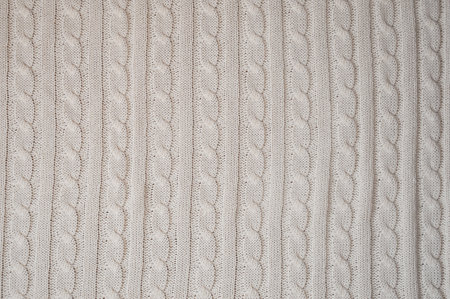 a knitted blanket. plaid with a braid pattern. background for the design.