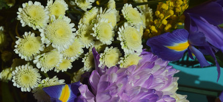 Flower bouquet of chrysanthemums and irisesの写真素材
