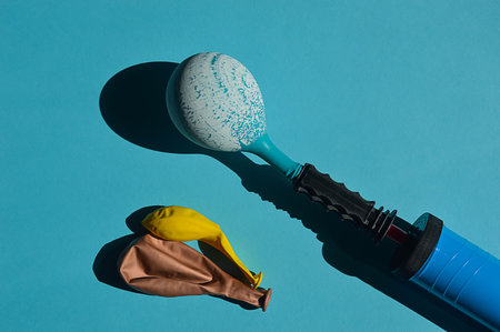 Flat lay composition with menstrual cup and tampon on blue backgroundの写真素材