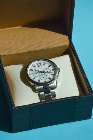 Wristwatch in a box on a blue background, close upの写真素材