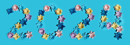 2021 new year made of paper flowers on a blue background.