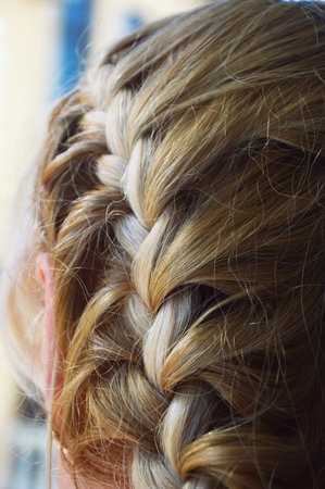 a braid of hair on a woman's head. hairstyle background for the design
