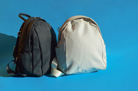 Backpack and backpack on blue background. Backpack and backpack.の写真素材