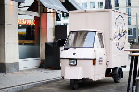 Berlin - Jan 2020: White cozy small mini bus food market. Small cozy retro street food cafe vans...