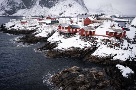 Famous tourist sightseeing Hamnoy fishing village on Lofoten Islands, Norway with red rorbu houses