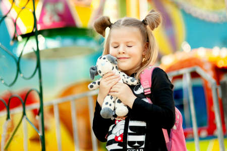 Cute little girl in amusement parkの写真素材