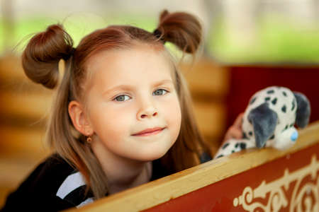 Cute little girl in amusement parkの写真素材