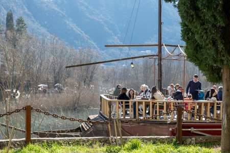 People on the terrace of a restaurant - About January 2023, Virpazar, Montenegroのeditorial素材