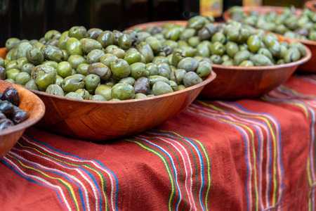 Green olives in wooden bowlsの写真素材