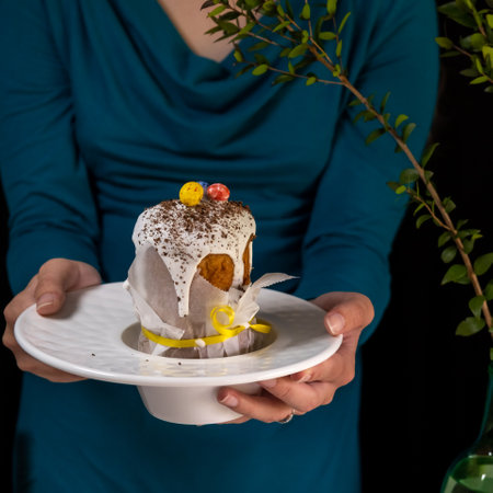 Easter cake in the hands of a girl. Copy spaceの写真素材