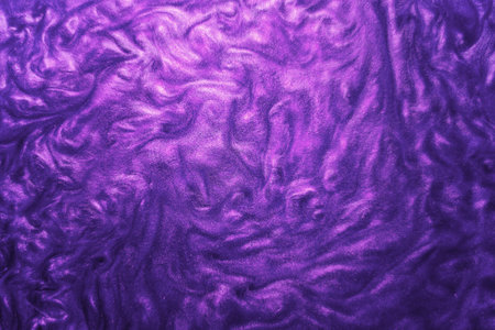 Selective focus. Close-up of the movement of the smallest purple particles moving in water. Abstract background of brilliant purple color. The shimmer moves underwater.の写真素材