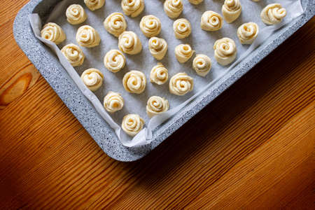 Dough for homemade cookies in metal baking sheet. Top view. Dough for making homemade cookies. Home...