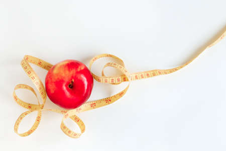 Red juicy Apple on a white wooden background. healthy food, detox dietの写真素材