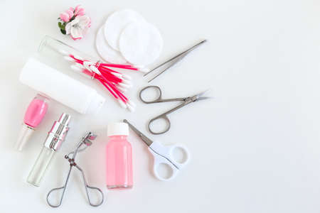 Manicure and pedicure accessories on a white background nail Care. professional nail accessories. steel tools for manicure set with transparent gel Polishの写真素材
